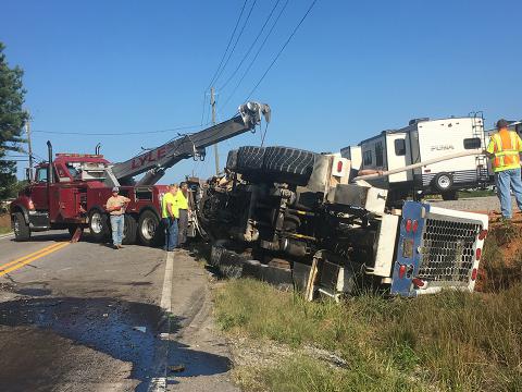 Lyle Wrecker Service prepares to remove a cement truck involved in a fatal accident this morning in Haleyville.