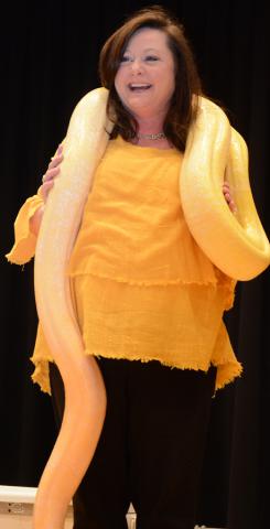 Haleyville Elementary Principal Christy Bice models the python snake for the young audience.