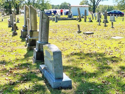 Righting leaning or sinking tombstones, like some of the ones pictured here, is some of the work needed in Lynn Cemetery.