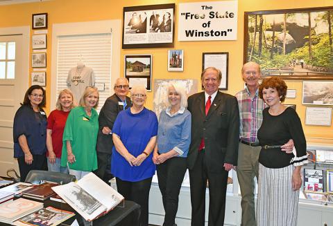 At the opening reception for the Winston County history display at the Bankhead House in Jasper are, from left, Mimi Hudson, Bankhead House Executive Director; Winston County Genealogical Society Member Treva Hood, Barbara Medders, Bankhead House coordinator; Paul Kennedy, Walker Area Community Foundation president; Winston County Genealogical Society Member Pat Taylor and Theresa Snoddy, J.D. Snoddy, Larry Welton and Blythe Welton, Winston County Arts Council members.