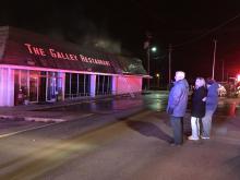 Haleyville Mayor Ken Sunseri, left, and Galley Restaurant owner Venita Armstrong Hamrick watch as firefighters battle the blaze.