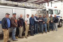 Garry Fowler with Branch Mission Ministry presents donation check to the Addison Volunteer Fire Department.