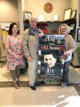 Pictured from left are Acting City Clerk Christy Harbin, Mayor Ken Sunseri and Auxiliary President Becky Linam with an example of one of the banners that may be purchased.