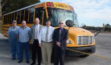 Pictured with the current buses some of which will be updated thanks to the $200,000 grant are, from left, Heath Tidwell, mechanic at the Winston County Transportation Office, Shop Foreman Jamie Blanton, Superintendent Greg Pendley, Transportation Supervisor Jeff Hendrix and Jerry Lassiter, financial adminitrator for the State Department of Education.