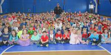 Addison native and Bassmaster Pro Elite Series Member Jesse Wiggins with Addison Elementary’s Dr. Seuss inspired students during Read Across America Week.