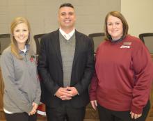Newly hired Haleyville High School football coach Chris Musso with HHS Principal Dr. Erika McCoy, left, and HCS Superintendent Dr. Holly Sutherland at the special called meeting Friday, Jan. 18.