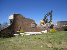 The old Henry E. McNutt Alfa building was torn down Friday, March 22. The demolition crew had 13th Avenue by the post office closed to perform the task.