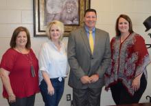 Welcoming Davey Reed on board as new principal of Haleyville High School, from left, Board of Education President Donna Jones, Chere Fetter, who has served as high school interim principal. Standing to the right of Reed is HCS Superintendent Dr. Holly Sutherland.