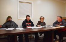 Council members Chris Little and Tommy Chambless, along with Clerk Marcia Manasco and Mayor Earl Gilbert discuss hiring a police chief.