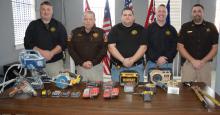 Shown with many of the recovered items, from left, Winston County Sheriff's Deputy B.J. Simmons, Sheriff Horace Moore, Investigators Jacob Eward and Caleb Snoddy and Chief Deputy Brett Rodgers.
