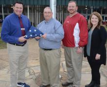 From left, Haleyville High School Principal Davey Reed, Woodmen Life Sales Rep Todd Dillard, John McCullar, assistant principal over the Center of Technology and High School Assistant Principal Candy Garner.