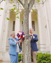 Governor Kay Ivey and First Baptist Church of Montgomery Patsor Jay Wolf tie the first ribbon as part of Ivey's Ribbons of Hope Campaign.