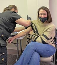 HCS Superintendent Dr. Holly Sutherland receives her COVID-19 vaccination from a health official on Tuesday, Jan. 12, at Lakeland Community Hospital in Haleyville.