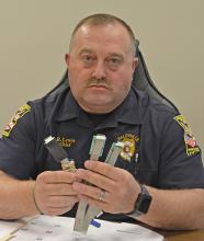 Haleyville Police Chief Rodney Lewis shows three Skimmers that have already been removed from gas pumps in the city.