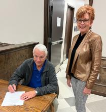 Haleyville Mayor Ken Sunseri signs a proclamation declaring October 16-22 National Business Women’s Week in Haleyville.  Shown with him is Haleyville Business and Professional Women’s Club President Gerita Rye.  (Courtesy photo)