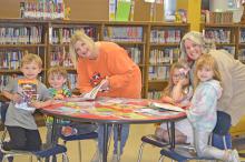 Shown are a few of the pre-K students in the Addison Elementary School After-School Program.  From left, Branson Traynom, Ryder Roberson, Amelia Woodard and Anslee Massey. Working with them are Rena Parris, left, site coordinator and AES Principal Sharon Naylor.