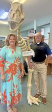 Arley Public Librarian Jennifer Stewart, left, and her husband, Jason, who is director of IT  operations for BankFirst, pose with the passenger they brought back to Arley from Laurel, Miss.  (courtesy photo)